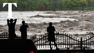 Two dead as Beijing is battered by widespread flooding