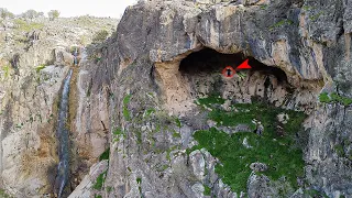 Zahra found a large cavern located beside a waterfall in the mountains.