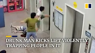 Chinese drunk man kicks lift violently, trapping people in it