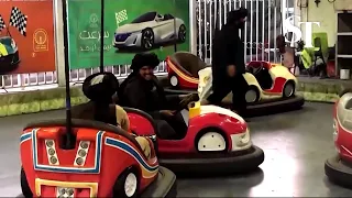 Watch Taliban play bumper cars at an amusement park