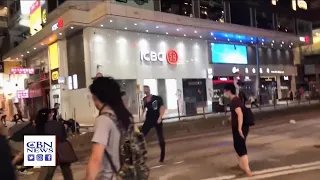 Hong Kong Protesters Briefly Clash with Police, Wave American Flags and Sing National Anthem