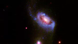 Supermassive black hole blowing huge bubbles of hot, bright gas