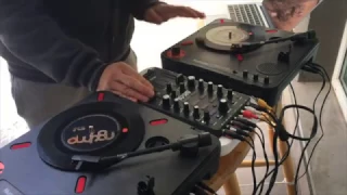 DJ NOT EAZY ON THE BALCONY WITH PORTABLE TURNTABLES