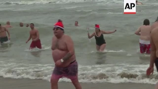 Thousands take New Year plunge in Dutch seaside town