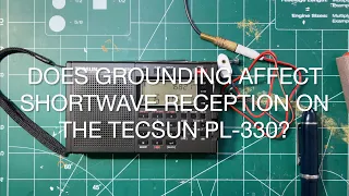 Does grounding affect shortwave reception on the Tecsun PL 330?