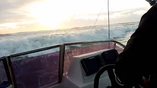 Launching through BIG waves at Shelly Beach