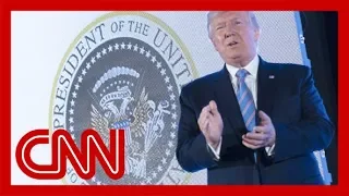 Aide fired after Trump appears with doctored presidential seal