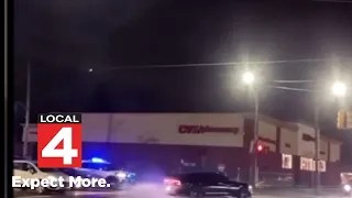 New video shows reckless drivers pulling donuts burnouts in front of the police