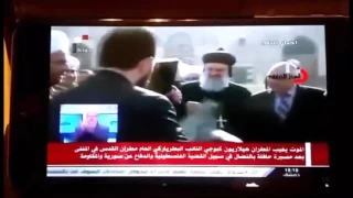 Syriac Patriarch Ignatius Aphrem II kisses the Quran