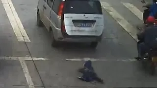 Child run over after falling from moving car