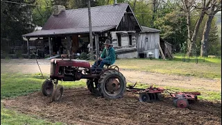 Tractor therapy, disking garden with a ￼￼1949 Farmall cub, 23-A tandem disk set￼