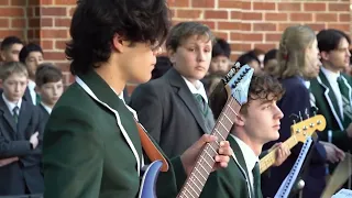 School of Rock performance of 'Long way to the top' at Trinity's Quad Assembly