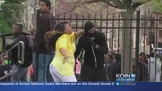 Watch: Baltimore mom beats son away from protest