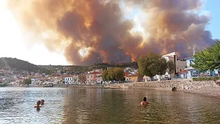 Wildfires: Hundreds evacuated by sea from Greek island as Athens fires intensify