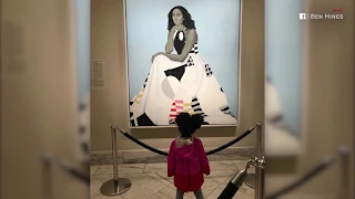 Toddler mesmerised by Michelle Obama painting