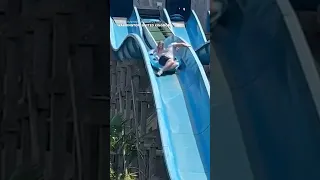 Wife laughs as husband scales waterpark slide to rescue stuck daughter #Shorts