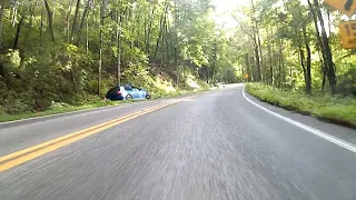 Miata at tail of the dragon chases VW R32 until it crashes