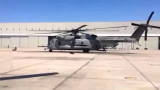 A 3rd MAW CH-53E from spins up to assist firefighters.