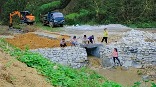 Completed 95% of the bridge overflowing the stream, redirecting the stream to the new sewer