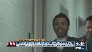 16-year-old murder suspect of father-to-be laughs his way into court