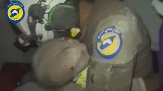 Rescue worker breaks down after saving baby girl in Syria