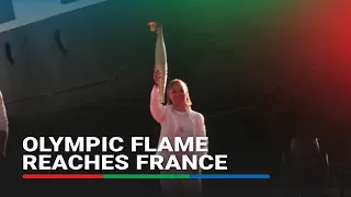 Olympic cauldron lit on French soil for Games