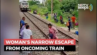 Watch: Woman’s Narrow Escape From Oncoming Train