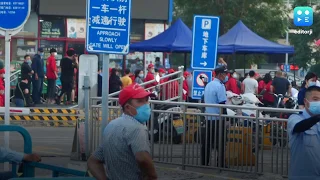 Beijing shuts down largest wholesale market after new cases