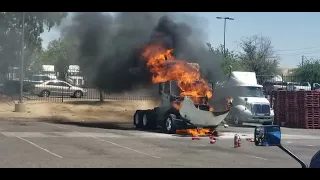 Truck on fire    employee fights the fire to try to put it out