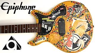 I restored a junk guitar covered in stickers.
