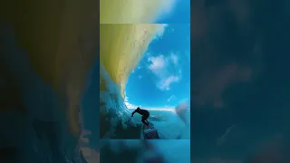 BARREL POV Behind SURFER