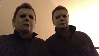 Nick Castle and James Jude Courtney wearing their Michael Myers masks and coveralls