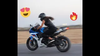 Cute girl riding a Super Bike