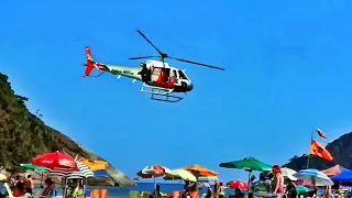 Helicóptero Águia sobrevoando Praia de Pernambuco no Guarujá