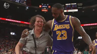 LeBron James Helps Woman Get Up After Knocking Her