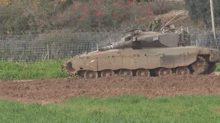 Israeli tanks move into position in the south as offensive in Gaza continues