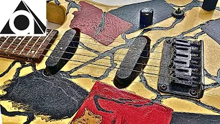 An unidentified electric guitar with a shaved body has been refinished.