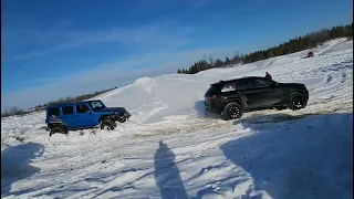 Grand cherokee pulling out Jeep Wrangler. Recovering jeep. Stuck in Snow