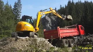 JCB 8085 midi excavator loading Tatra truck with gravel