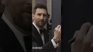 Lionel Messi signs the Laureus World Sports Awards wall