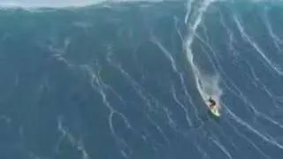 man surfing a tsunami