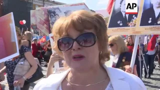 Thousands march in Immortal Regiment