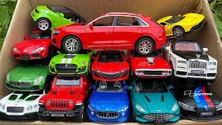 Box full of Audi Q8, Smart Fortwo, Rolls Royce, Jeep, Dodge Charger, Ferrari.