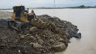 Amazing large capacity land reclamation in lake Construction bulldozer push rock stone at new level