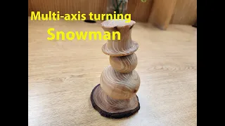 Turning a multi-axis snowman from a cedar branch