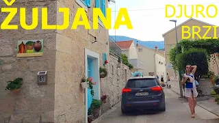 Driving a car through Žuljana, Pelješac, Dalmatia, Croatia, August 2023