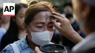 Catholics in the Philippines have their foreheads marked with ash during Ash Wednesday