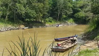 Crossing the border from Thailand to Malaysia by boat on the golok river