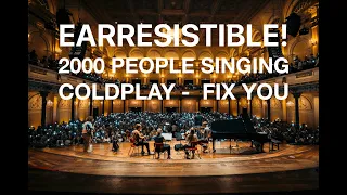Unbelievable! 2000 strangers singing Fix You by Coldplay in massive concert hall