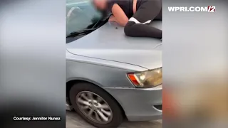 VIDEO NOW: Man drives 3 miles with woman stuck to his car hood